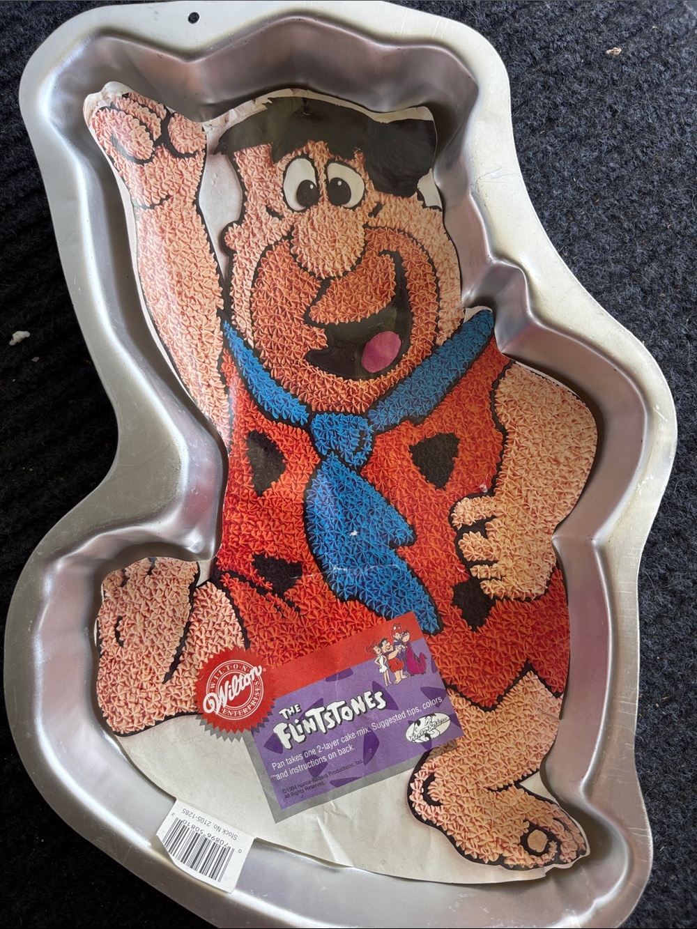 Wilton Fred Flintstone Cake Pan with Orange and Blue Accents